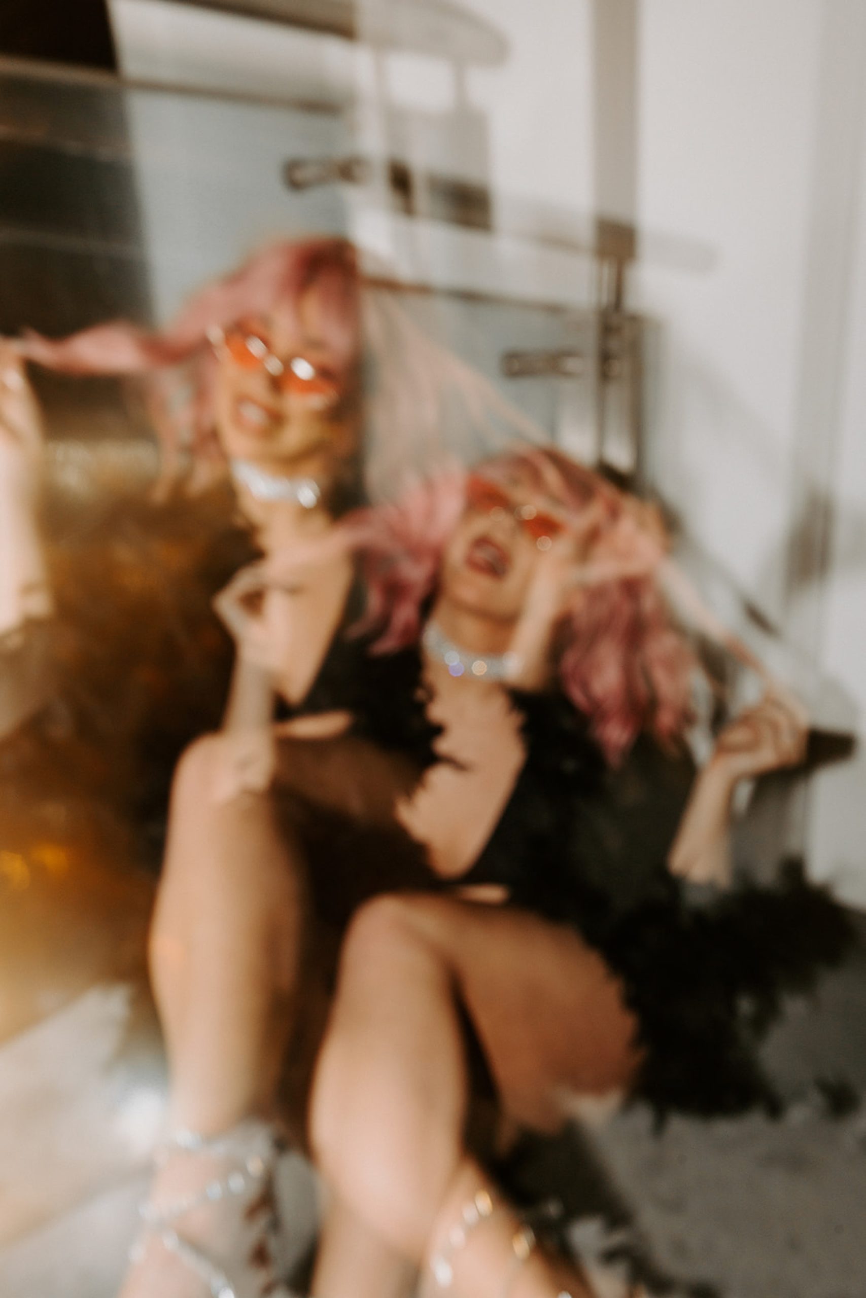 blurry photo of girl in pink wig and lingerie