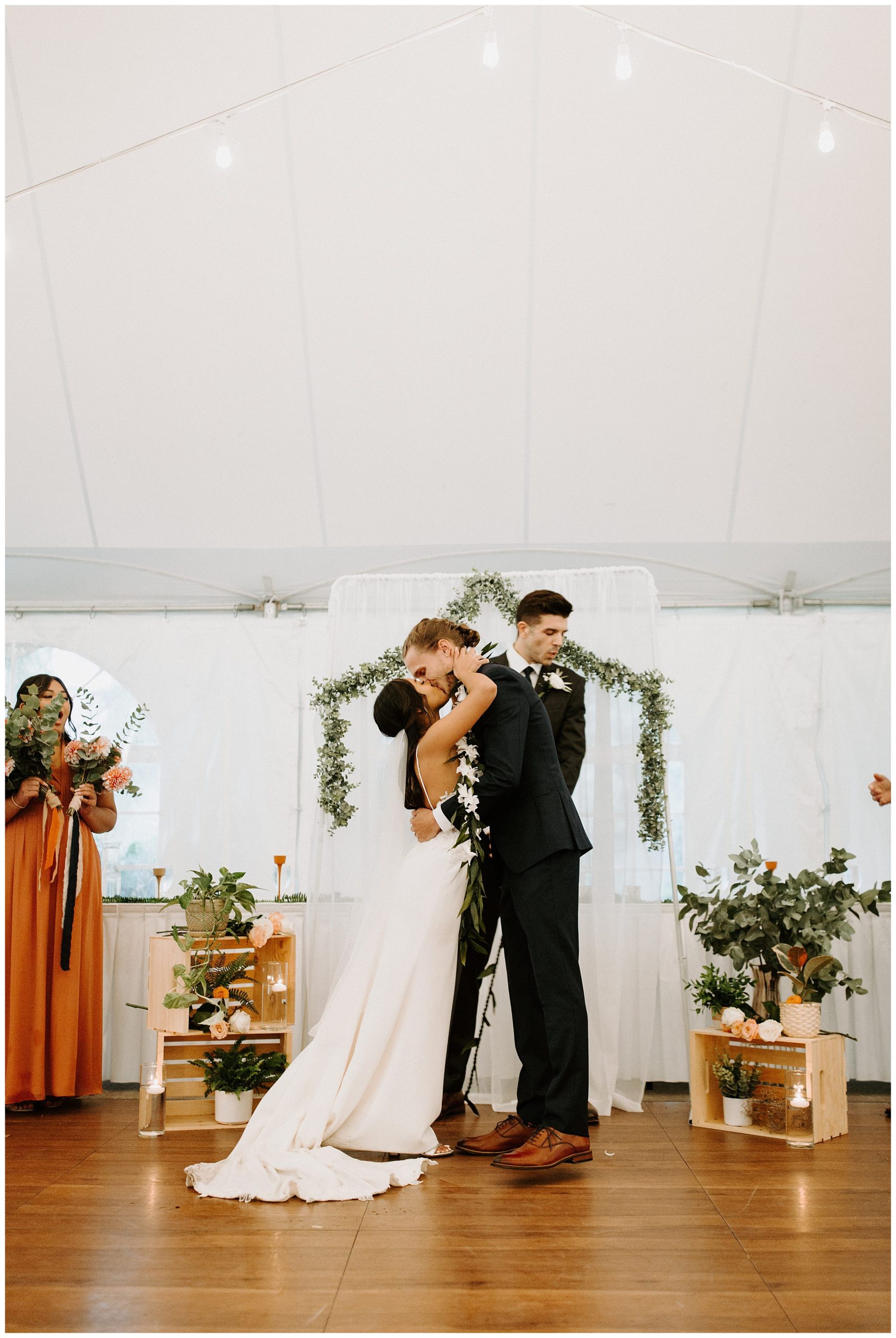 bride and groom kissing, first kiss at wedding ceremony