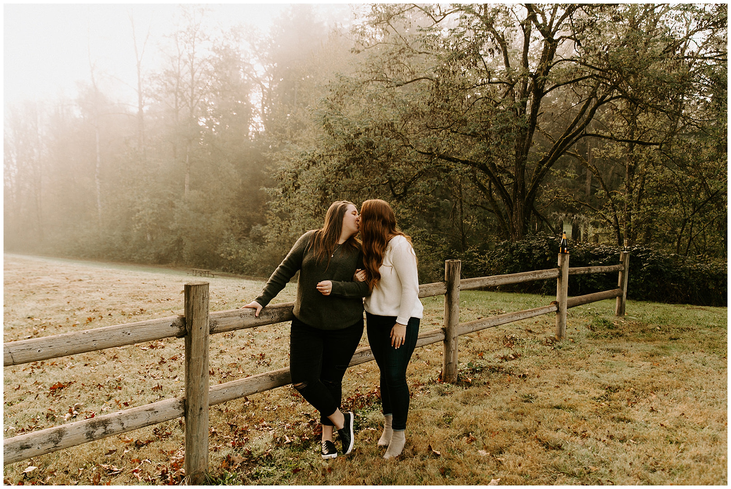 girls kissing in park for engagement photos