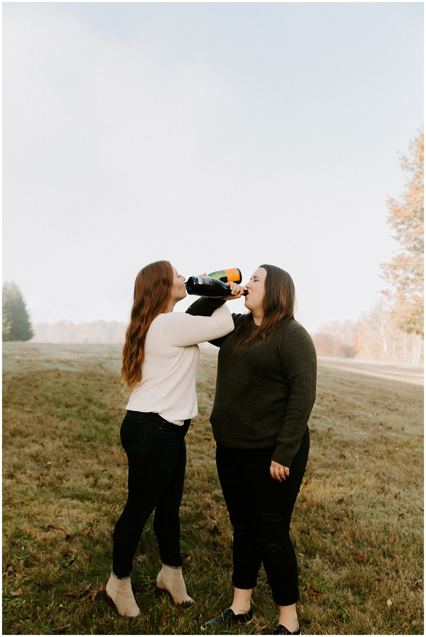girls drinking champagne at engagement session