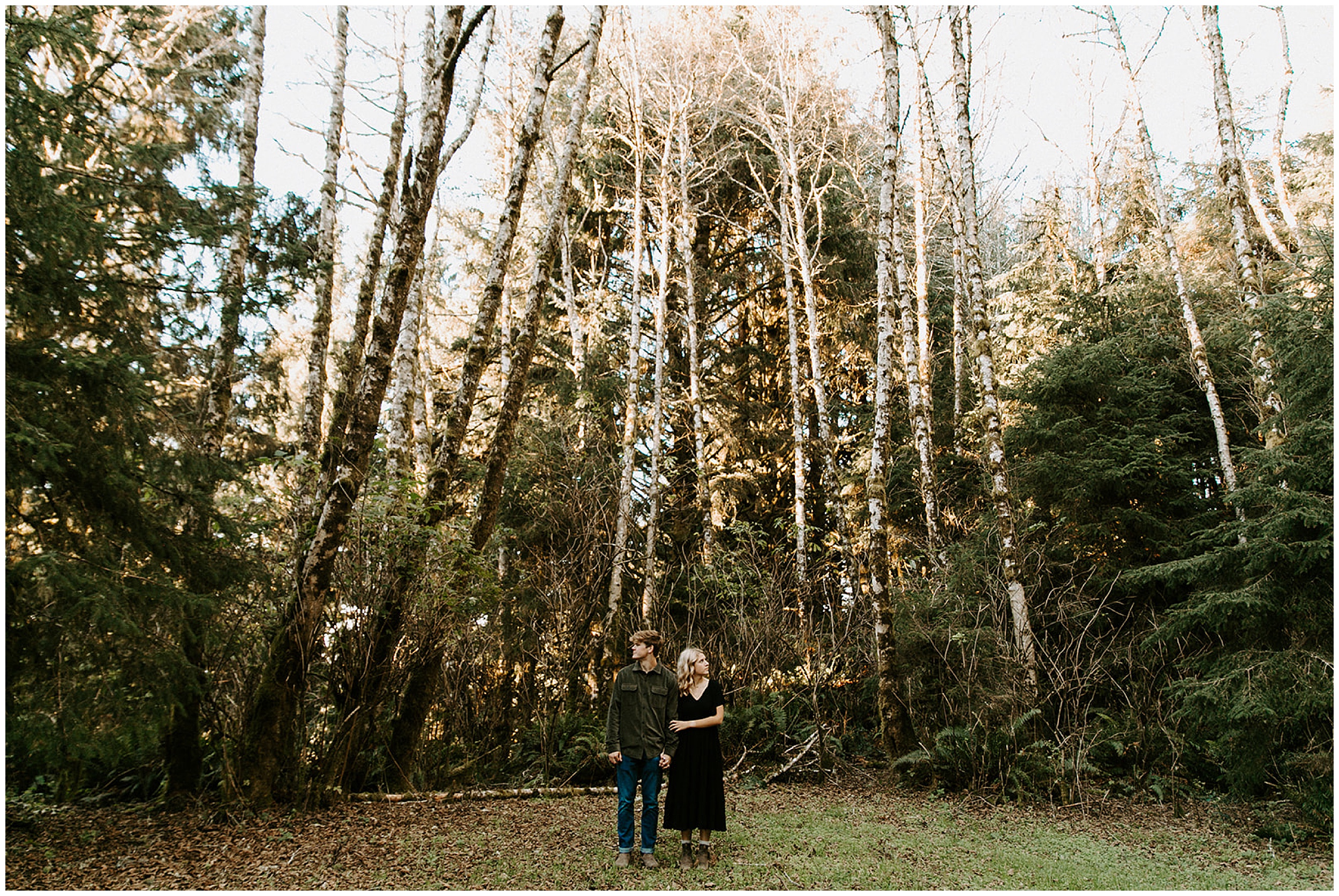 couple standing in forest