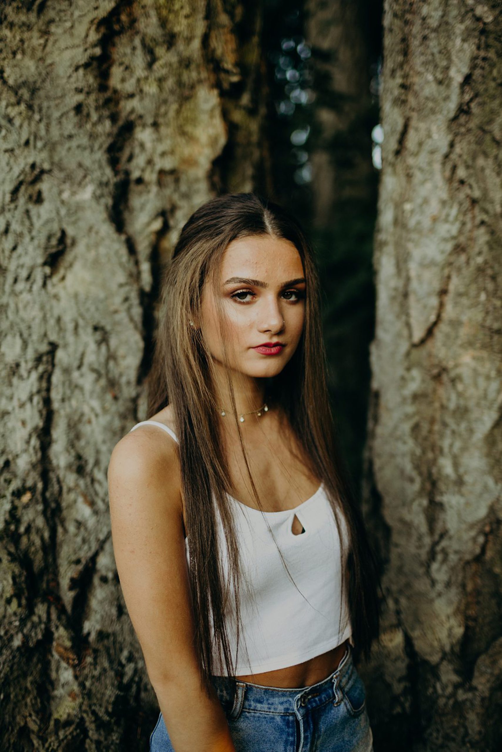 girl modeling in front of tree