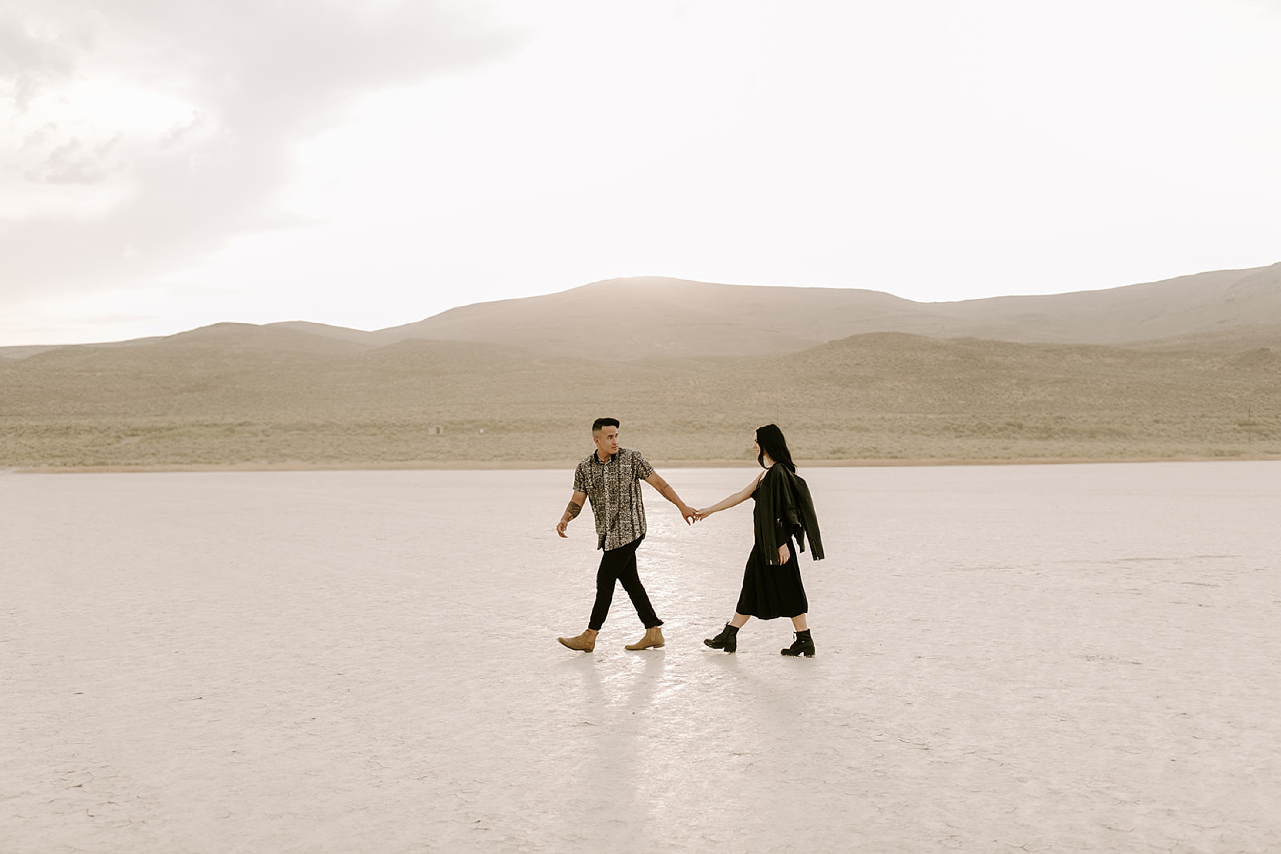 couple walking at alvord desert