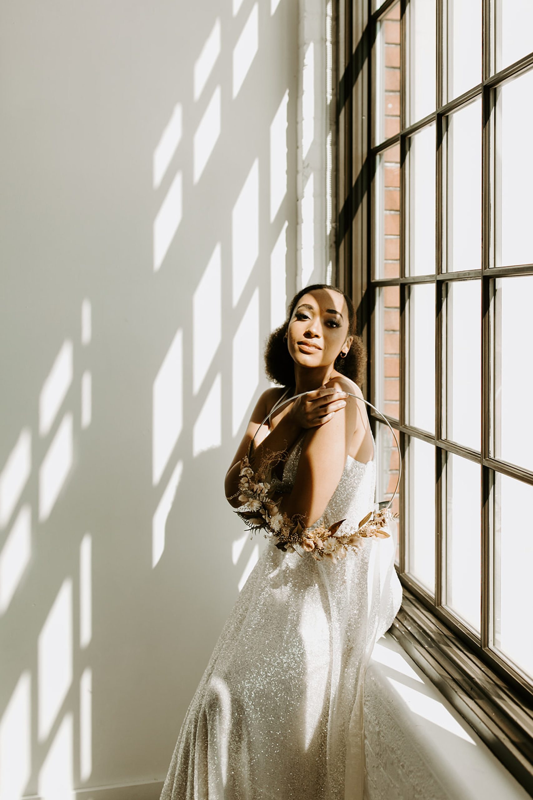 bride modeling by window