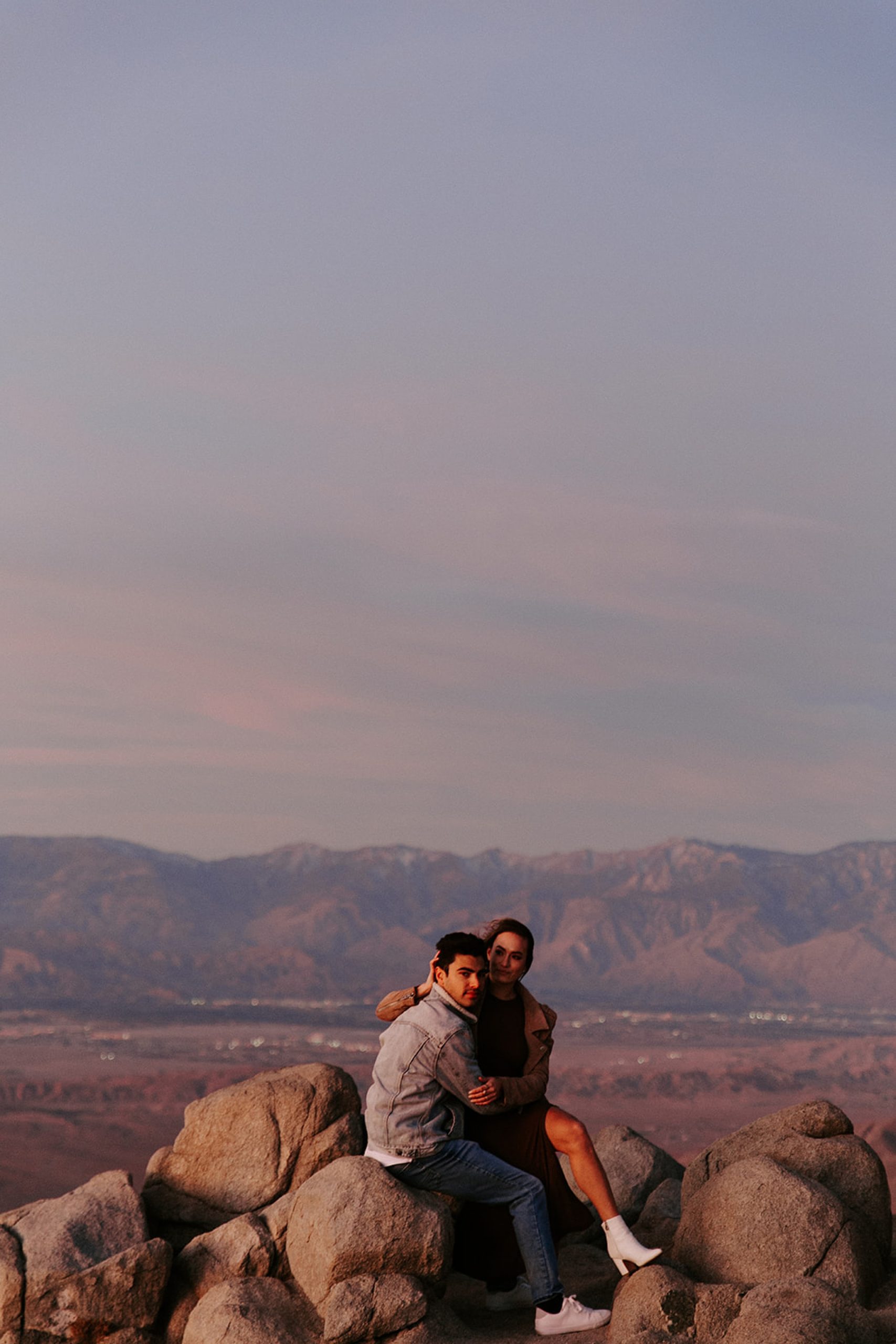 couple sitting on rocks