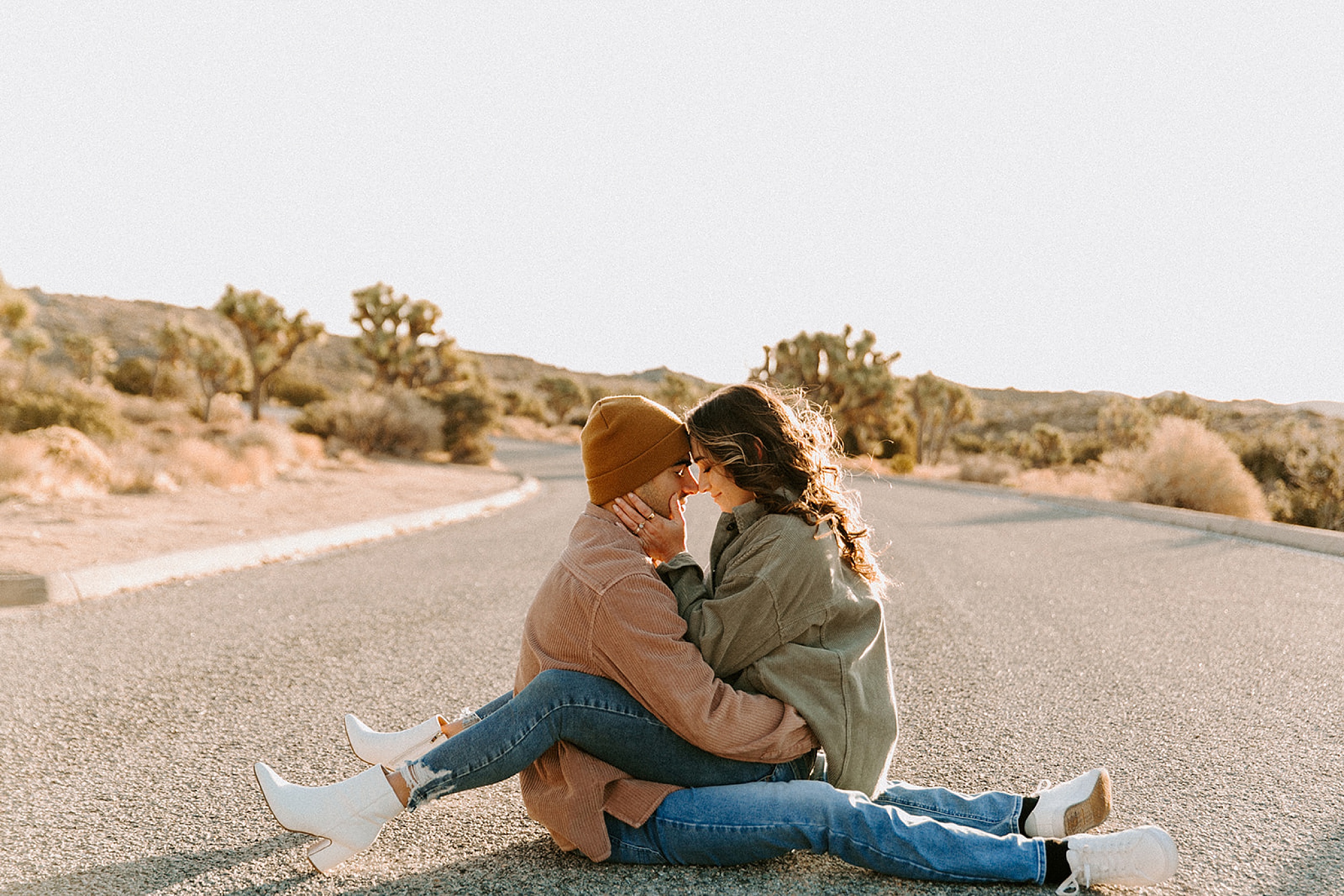 couple sitting on road