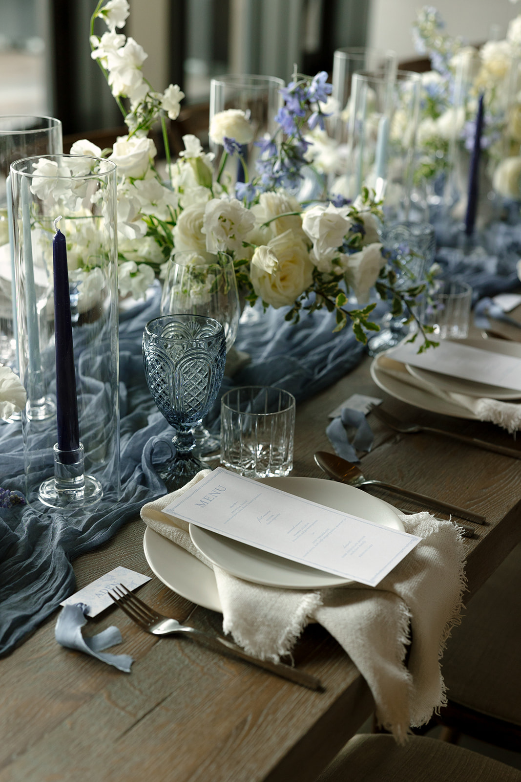 wedding table blue accent decor and florals